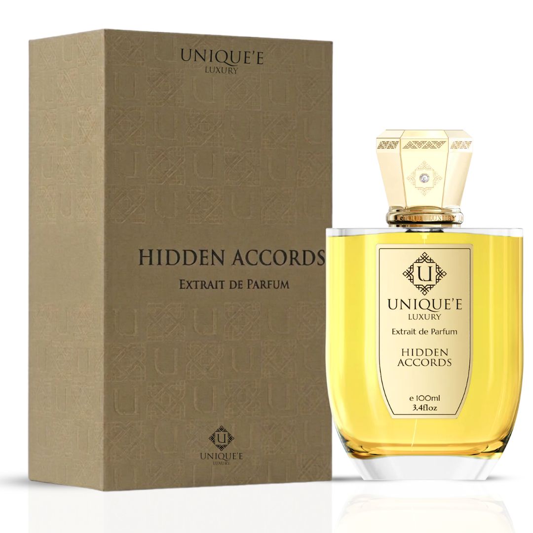 Unique'e Luxury Hidden Accords Extrait de Parfum 100ml bottle, elegant glass EDP with gold accents and floral design.