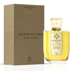 Unique'e Luxury Hidden Accords Extrait de Parfum 100ml bottle, elegant glass EDP with gold accents and floral design.