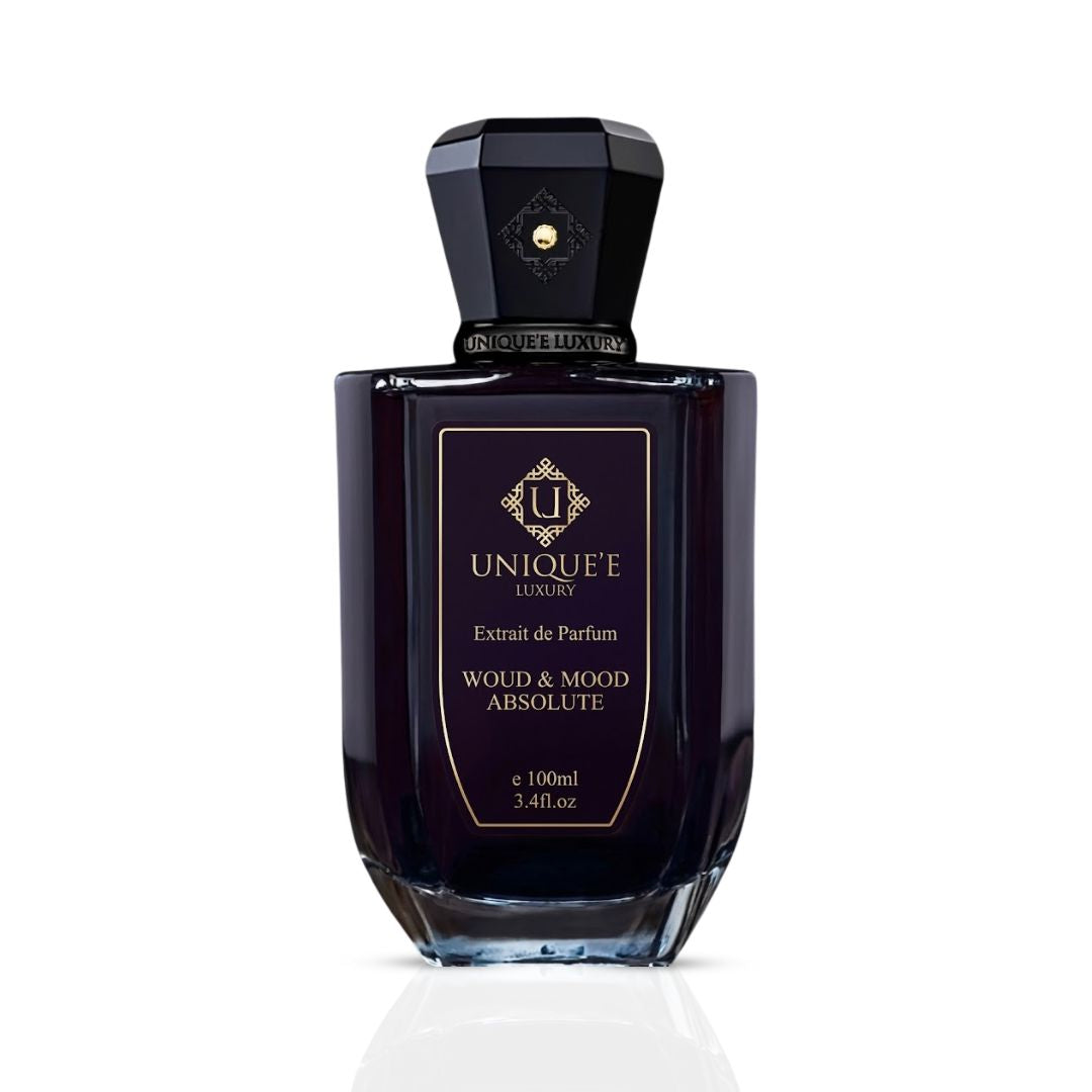 Unique'e Luxury Woud & Mood Absolute Extrait de Parfum 100ml EDP bottle with elegant design and luxurious fragrance details.