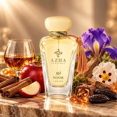 Azha Noor Eau de Parfum Spray 100ml, elegant glass bottle with gold accents, showcasing the luxurious fragrance.