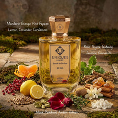 Unique'e Luxury Beril Extrait de Parfum Spray 100ml, elegant glass bottle with gold accents, showcasing luxury fragrance.