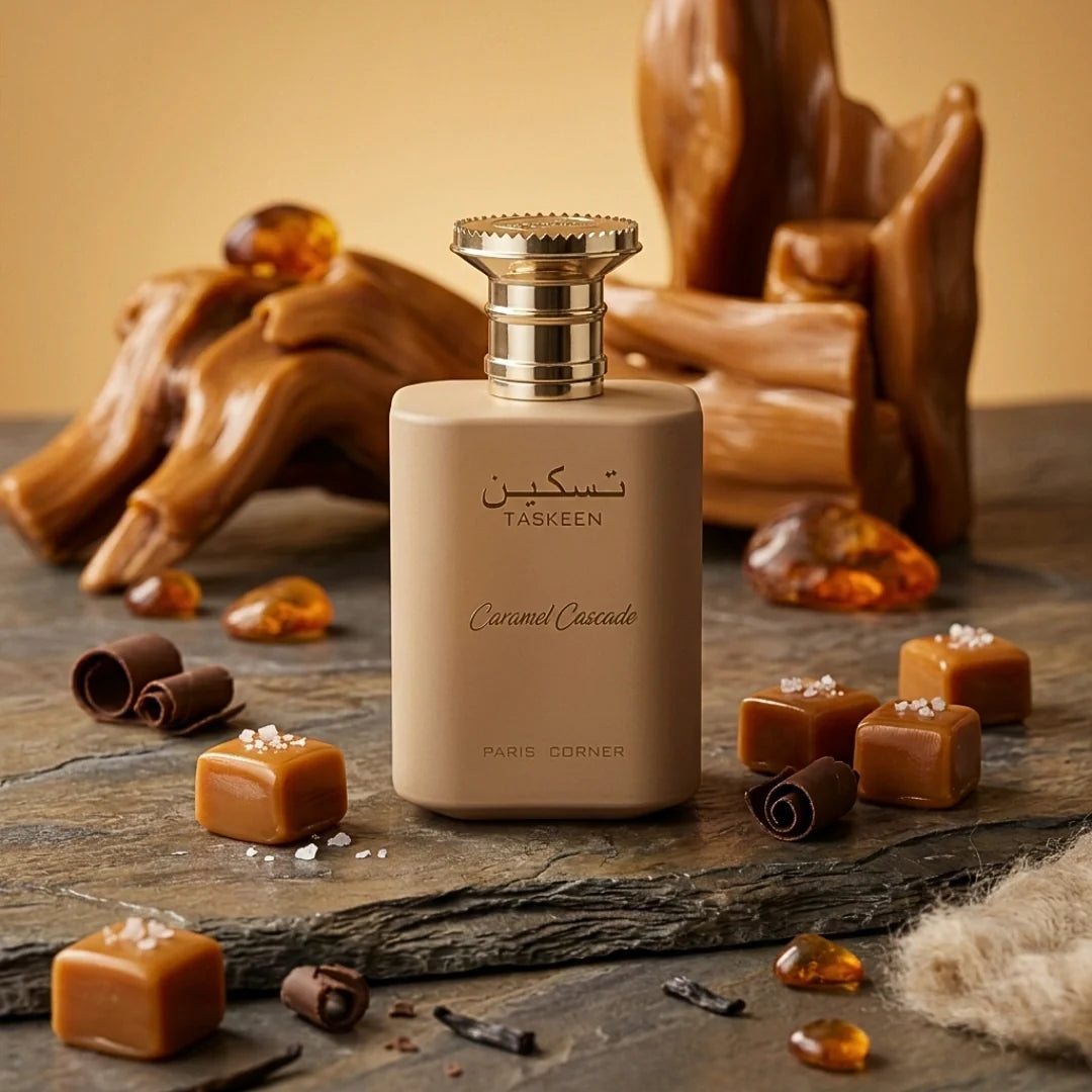 Paris Corner Taskeen Caramel Cascade Eau de Parfum spray 100ml, elegant glass bottle with caramel-colored liquid inside.