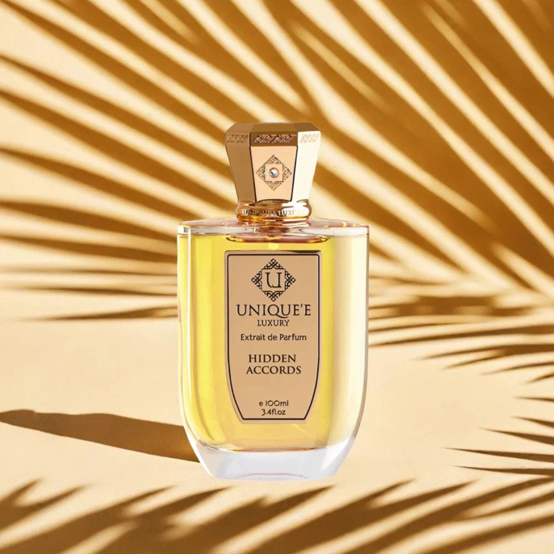 Unique'e Luxury Hidden Accords Extrait de Parfum 100ml bottle, elegant glass container for EDP fragrance display.