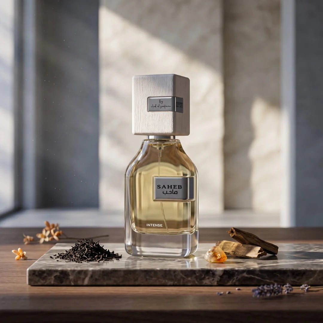 Saheb Intense Eau de Parfum spray by Ard Al Zaafaran, 100ml, featuring a sleek glass bottle with a gold cap and elegant design.