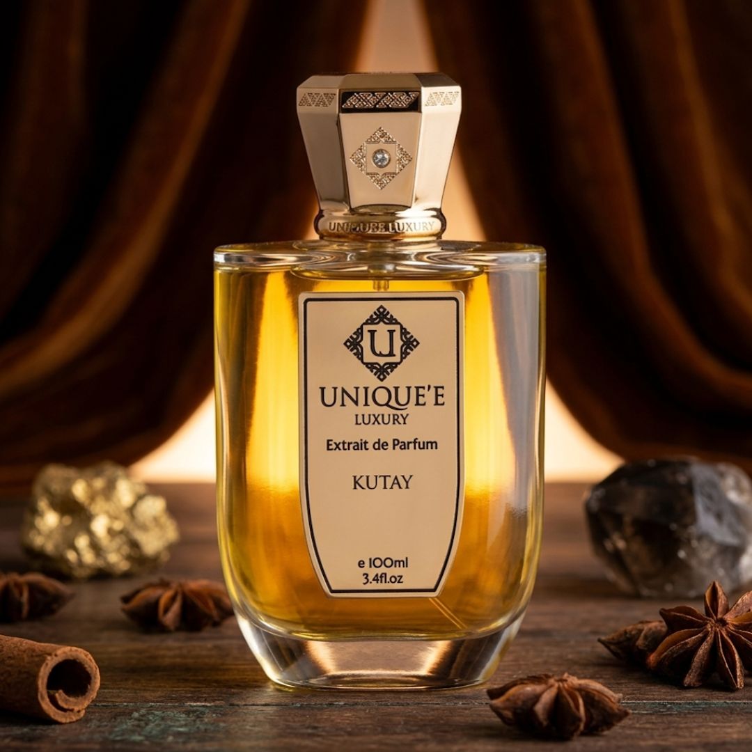 Unique'e Luxury Kutay Extrait de Parfum Spray 100ml, elegant perfume bottle with sleek design and gold accents.