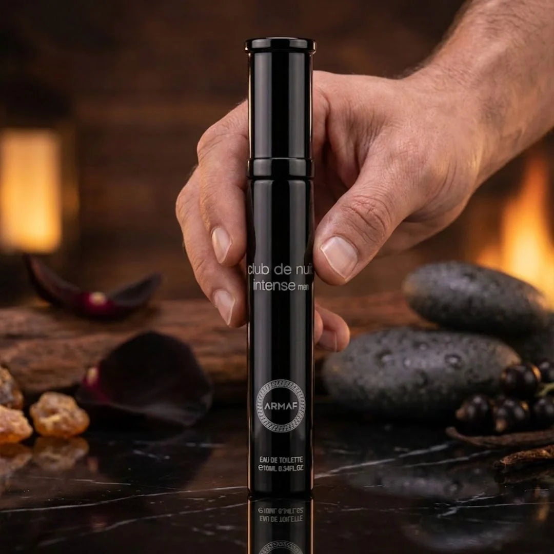 Travel size Armaf Club De Nuit Intense Man Eau de Toilette spray 10ml bottle with sleek black packaging.