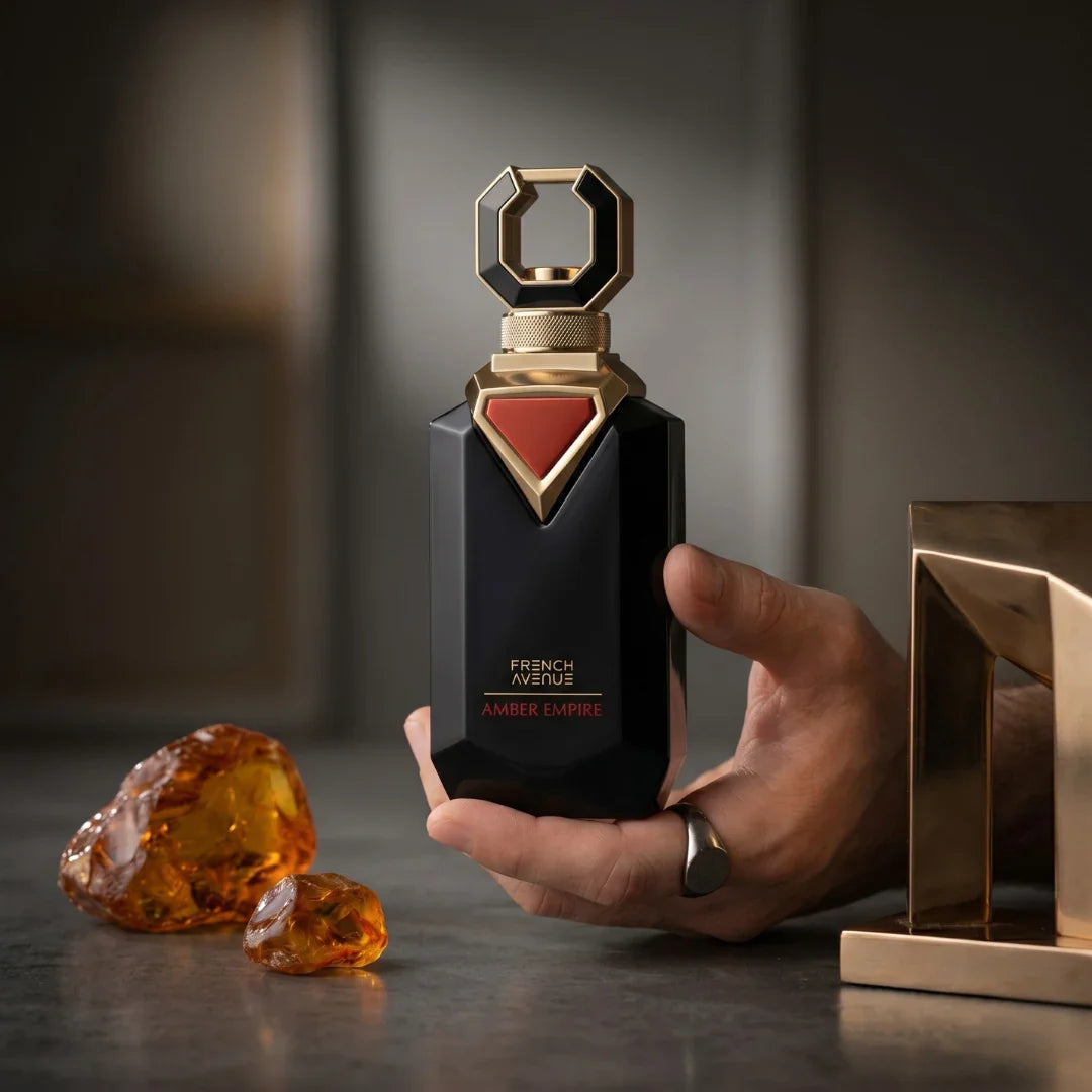 French Avenue Amber Empire Eau de Parfum spray 100ml bottle showing elegant packaging and amber-colored liquid inside.